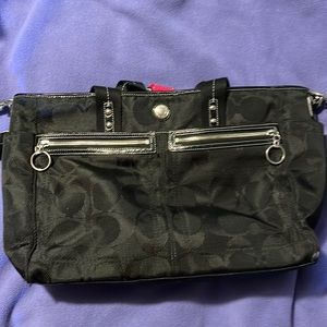 Black coach diaper bag with pink interior lining- used but in great condition